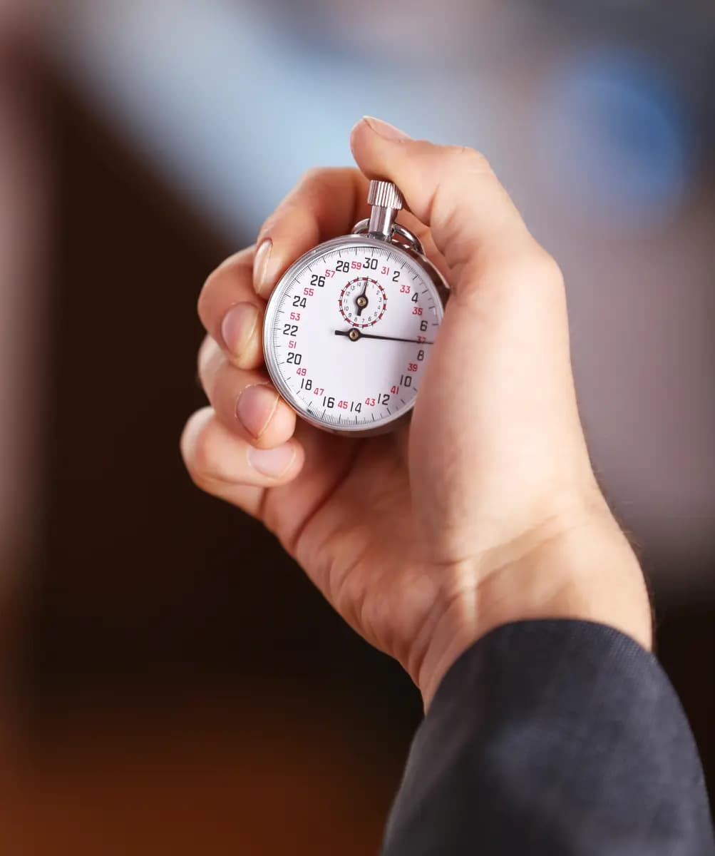 Decorative stopwatch in hand